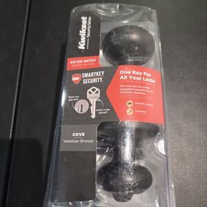 Kwikset Cove Venetian Bronze Keyed Entry Door Knob featuring SmartKey Security